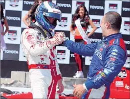  ?? Robert Laberge Getty Images ?? New Zealander Scott Dixon, left, celebrates with teammate Tony Kanaan.