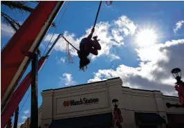  ?? CALLA KESSLER / THE PALM BEACH POST ?? Endora Guillaume, 15, bungee jumps at the Palm Beach Outlets on Palm Beach Lakes Boulevard on Friday.