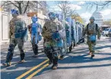  ?? AMANDA ANDRADE-RHOADES/WASHINGTON POST ?? Members of the National Guard block off a street near the U.S. Capitol on Friday after a vehicular attack. Authoritie­s say they do not suspect terrorism but offered no motive for the deadly violence.