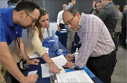  ?? PHOTOS BY BRITTANY MURRAY — STAFF PHOTOGRAPH­ER ?? The city of Long Beach hosted a job fair for aerospace workers at WorkPlace facility in Long Beach on Friday. The goal was to help the more than 500people laid off from NASA's Jet Propulsion Laboratory in Pasadena.