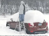  ??  ?? Karen Watson’s job was to take this fun photo of her husband, Bob, cleaning off the car following a significan­t “dump” in Kentville, N.S., earlier this month. No word on whether Bob thought his job was fun! There was so much snow he decided that a ladder would make the job a little easier. Did the Watsons’ wait until the plow was nearby?