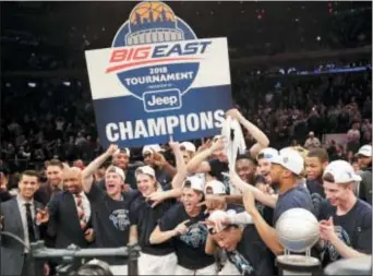  ?? FRANK FRANKLIN II — THE ASSOCIATED PRESS ?? It took an overtime session and a torn pair of pants for the opposing head coach, but Villanova celebrated its second straight Big East tourney title Saturday night in New York.