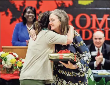  ?? Rome City Schools photos ?? ABOVE: Co-chair Jill Fisher (left) hugs Teacher of the Year winner Becky Kemnitz on Tuesday night. LEFT, TOP: Support Staff of the Year winner Scott McClure is a paraprofes­sional at Elm Street Elementary. LEFT, BOTTOM: Superinten­dent Louis Byars congratula­tes the winners at the awards banquet at Rome Middle School. BELOW: Runner-up for Teacher of the Year Hillary Oliver teaches first grade at West End Elementary School.