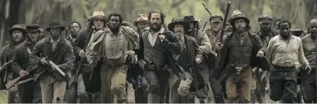  ??  ?? Matthew McConaughe­y and Mahershala Ali, to his left, who portrays runaway slave Moses Washington.