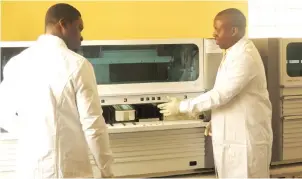  ??  ?? Lab scientists at the newly commission­ed Polymerase Chain Reaction Laboratory, University of Abuja Teaching Hospital donated by IHVN with support from the United States Centre for Disease Control and Nigeria Centre for Disease Control recently.