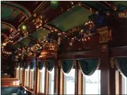  ?? MICHELLE N. LYNCH — MEDIANEWS GROUP ?? Passengers on Colebrookd­ale Railroad’s parlor car are surrounded by gleaming brass, art glass and polished mahogany trims. The railroad attempts to recreate the travel experience of the pre-World War I years in the U.S.