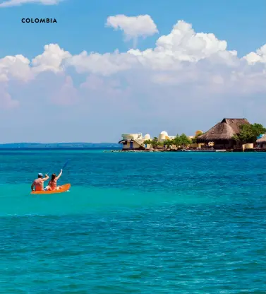  ?? ?? Above: Kayakers explore the waters around Isla Grande, part of the Rosario Islands