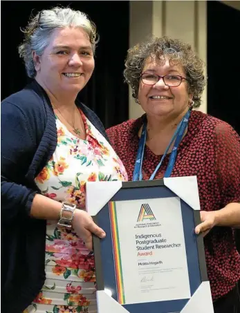  ?? PHOTO: AARE ?? RECOGNISED: Melitta Hogarth (left) was presented with the AARE Indigenous Postgradua­te Student Researcher Award. She is joined by USQ Head of CISER Professor Tracey Bunda.