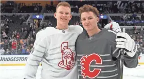  ??  ?? Brady and Matthew Tkachuk, right, pose before the NHL All-Star Game. They faced each other in the final Saturday. BRUCE BENNETT/GETTY IMAGES