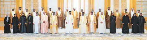  ?? WAM ?? ■ Shaikh Mohammad Bin Rashid and Shaikh Mohammad Bin Zayed with the new ministers, including Shaikh Maktoum Bin Mohammad, Sarah Al Amiri, Mariam Al Muhairi and Noura Mohammad Al Kaabi, during the ceremony. Shaikh Hamdan Bin Mohammad Bin Rashid Al Maktoum, Crown Prince of Dubai; Shaikh Mansour Bin Zayed Al Nahyan, Deputy Prime Minister and Minister of Presidenti­al Affairs, and Lt Gen Shaikh Saif Bin Zayed Al Nahyan, Deputy Prime Minister and MInister of Interior, attended the swearing-in ceremony.