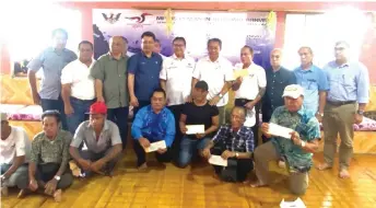  ??  ?? Nanta (standing fifth left) with (from fourth left) Cerisologo, Nyabong, Tuai Rumah Tang Kok, Tapah, Daniel and Watson posing with the MRP recipients.