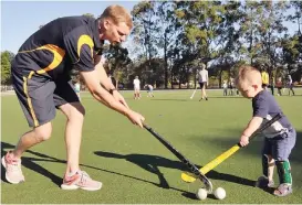  ??  ?? This is where great hockey players begin: Dad, Michael Ballantyne gives his son Xavier some one-on-one coaching