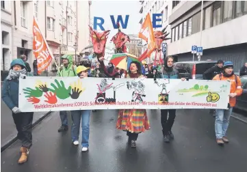  ?? —IPS photo by Emilio Godoy ?? In the Nov 11 Climate March through the main streets of the German city of Bonn, protesters called for an end to the use of coal as a power source, especially by German companies, such as RWE.