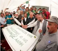  ??  ?? Syed Javed Hassan, Consul-General of Pakistan, with other officials during the cake-cutting ceremony at the Pakistani consulate.