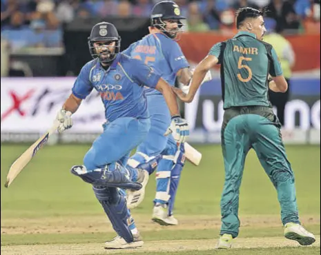  ?? AFP ?? Rohit Sharma (right) made 52 and put on 86 for the first wicket with Tuesday’s centurion Shikhar Dhawan.