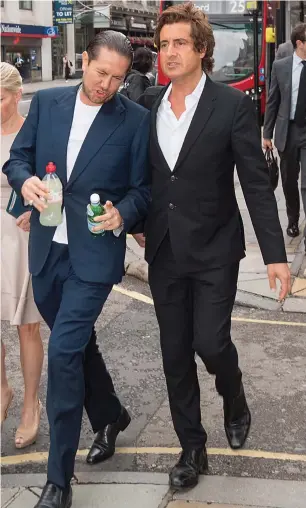  ??  ?? Thirsty work: James Stunt with celebrity lawyer David Sherbourne