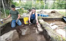  ?? NWA Democrat-Gazette/J.T. WAMPLER ?? Archaeolog­y students Kayden Dennis (left) and Madison Atchley dig in Feature 2 at the Leetown hamlet site at Pea Ridge National Military Park. The pit revealed piers and a ramp of a cellar that served three generation­s of farm families, dating back to...