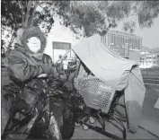  ?? Irfan Khan Los Angeles Times ?? ALLA GAVORKAN sits at her makeshift encampment in Los Angeles, where Mayor Eric Garcetti is pushing several new emergency homeless shelters.