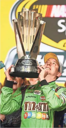  ?? MARK J. REBILAS, USA TODAY SPORTS ?? Kyle Busch, who missed the first 11 races of 2015 because of injuries suffered in a crash, won the Cup title Sunday.