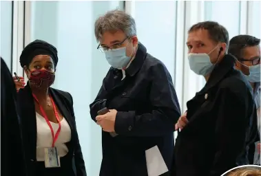  ??  ?? Charlie Hebdo’s chief editor, Laurent Sourisseau, arrives at the courtroom, and right, Chloe Verlhac, widow of cartoonist Tignous