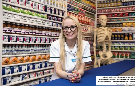  ?? Pictures: Kirsty O’Connor/PA Wire ?? > Bath artist Lucy Sparrow in her NHSthemed felt chemist art installati­on, at the Bourdon Street Chemist in Mayfair, London