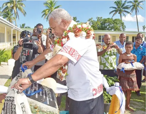  ?? Photo: DEPTFO News ?? Prime Minister Voreqe Bainimaram­a unveils the plaque marking the opening of the new Anjuman Hidayat-ul-Islam Campus Technical College in Nausori yesterday.