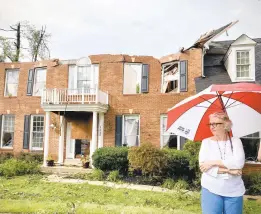  ??  ?? Debbie Angevine stands outside her home on Red Admiral Court in the Edgewater area that was damaged by the remnants of Tropical Depression Ida on Wednesday. KARL MERTON FERRON/BALTIMORE SUN