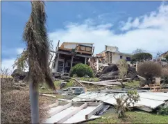  ?? Contribute­d photo by Charlotte Atkins ?? Kathy Michelle “Smo” and Kevin Raymond’s house shows major damage after Category 5 Hurricane Irma pummeled St. Thomas and other Caribbean islands.