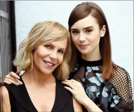  ?? PHOTO BY CHRIS PIZZELLO/INVISION/AP ?? Writer-director Marti Noxon, left, and actress Lily Collins pose at the London West Hollywood hotel to promote their film, "To the Bone," in West Hollywood, Calif.