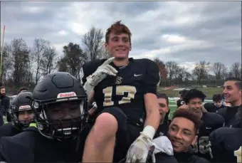  ?? COURTESY BRUCE BADGLEY - PA FOOTBALL NEWS ?? Berks Catholic sophomore Anthony Myers is lifted on the shoulder of teammates after the Saints’ win over Milton Hershey on Nov. 17.