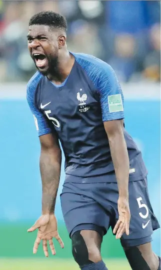  ?? PETR DAVID JOSEK/THE ASSOCIATED PRESS ?? France’s Samuel Umtiti celebrates his team’s 1-0 victory over Belgium during their World Cup semifinal Tuesday in St. Petersburg, Russia. Umtiti scored the match’s decisive goal.
