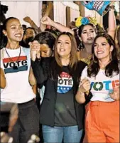  ?? GASTON DE CARDENAS/AFP-GETTY ?? Actresses and activists Zoe Saldana, from left, Eva Longoria and America Ferrera march during “Latinas en Marcha,” an election rally with other Latin-American celebritie­s Sunday in Miami.