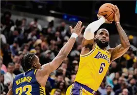  ?? Michael Conroy / Associated Press ?? Lakers forward Lebron James is 35 points away from matching Kareem Abdul-jabbar’s NBA scoring record of 38,387 points.