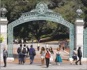  ?? Ben Margot Associated Press ?? ELIGIBLE borrowers will receive $10,000 to $20,000 in loan forgivenes­s. Above, students at UC Berkeley.