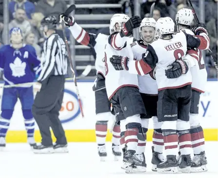  ?? NATHAN DENETTE/ THE CANADIAN PRESS ?? The Arizona Coyotes celebrate a goal during second period of action against the Toronto Maple Leafs, in Toronto on Monday. The Coyotes beat the Leafs 4-1, ending their six-game winning streak.