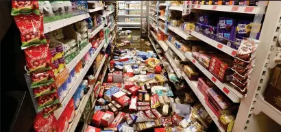  ??  ?? Mess: A Sainsbury’s branch which was hit by floods in Hebden Bridge, West Yorkshire