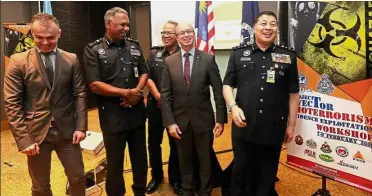  ??  ?? Reason to smile: (From left) Sandev, DCP Narenasaga­ran, DCP Raja Shahrom, Adriao and Comm Wan Ahmad sharing a light moment in Putrajaya.