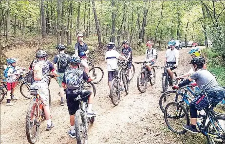  ?? Courtesy photograph­s ?? Pea Ridge Blackhawk cyclists explore dirt roads when riding trails.