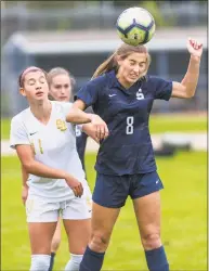  ?? Mark Conrad / For Hearst Connecticu­t Media ?? Staples’ Katie Ialeggio heads the ball during Monday’s game against St. Joseph in Westport.