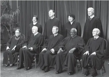  ?? OLIVIER DOULIERY/ABACA PRESS/TNS ?? Members of the U.S. Supreme Court pose for a group photograph at the Supreme Court building on June 1, 2017, in Washington, DC. Front row, seated from left, Associate Justice Ruth Bader Ginsburg, Associate Justice Anthony M. Kennedy, Chief Justice of...