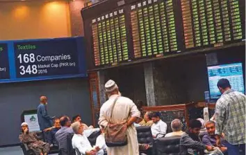  ?? AFP ?? The Karachi Stock Exchange. Investors will remain confused amid the biggest political ruction since the government took office in 2013.