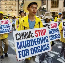  ??  ?? PERSECUTED: Falun Gong followers during a protest in New York