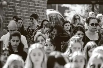  ?? Steve Parsons / Associated Press ?? Slain teacher James Furlong is mourned at the Holt School, in Wokingham, England. Furlong’s friend, Joe Ritchie-Bennett of Philadelph­ia, also died in a terrorist stabbing attack.