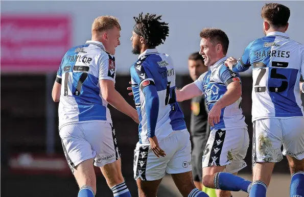  ?? ?? Rovers players celebrate after Sam Finley, second right, had scored their first equaliser in yesterday’s FA Cup tie against Oxford