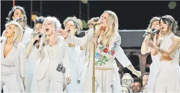  ??  ?? Kesha (second right) performs ‘Praying’ with Bebe Rexha (left), Cyndi Lauper and Camila Cabello (right). • (Right) SZA performs ‘Broken Clocks’ at the 60th Annual Grammy Awards Sunday. — Reuters photos