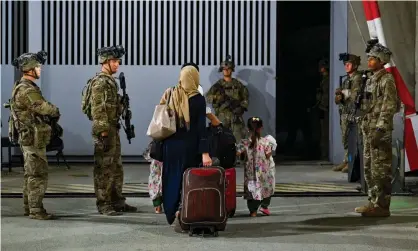  ?? Photograph: EPA ?? US troops oversee the evacuation of Afghan citizens at Kabul internatio­nal airport.