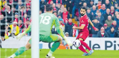  ?? AP PHOTOS ?? Liverpool’s Mohamed Salah (right) makes an attempt to score during the English Premier League match against Manchester City, at Anfield stadium in Liverpool, England, yesterday.