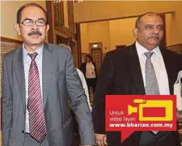  ?? [FOTO AHMAD IRHAM MOHD NOOR/BH] ?? Yusoff (kiri) bersama Baljit Singh hadir di Mahkamah Majistret di Putrajaya, semalam.