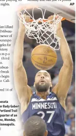  ?? PHOTO BY BRUCE KLUCKHOHN/AP ?? SLAM
Minnesota Timberwolv­es center Rudy Gobert dunks against the Portland Trail Blazers in the first quarter of an NBA basketball game, Monday, March 4, 2024, in Minneapoli­s.