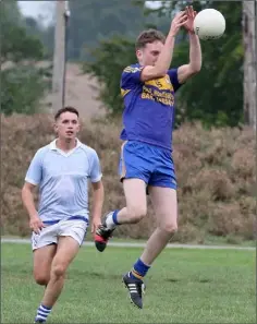  ??  ?? Sean O’Connor of Gusserane O’Rahilly’s fields this ball ahead of Fergal Doran of Oylegate-Glenbrien.